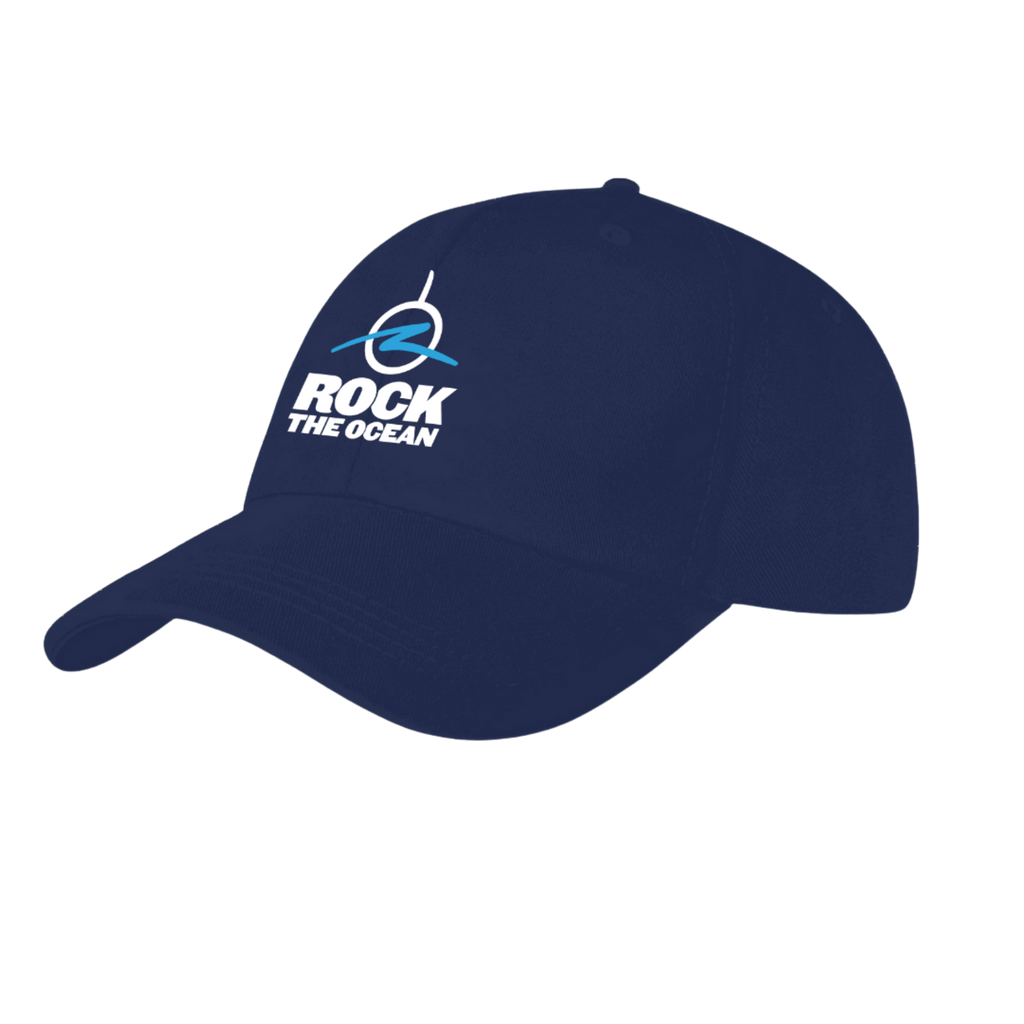 Navy blue cap with 'Rock the Ocean' logo on a sandy beach