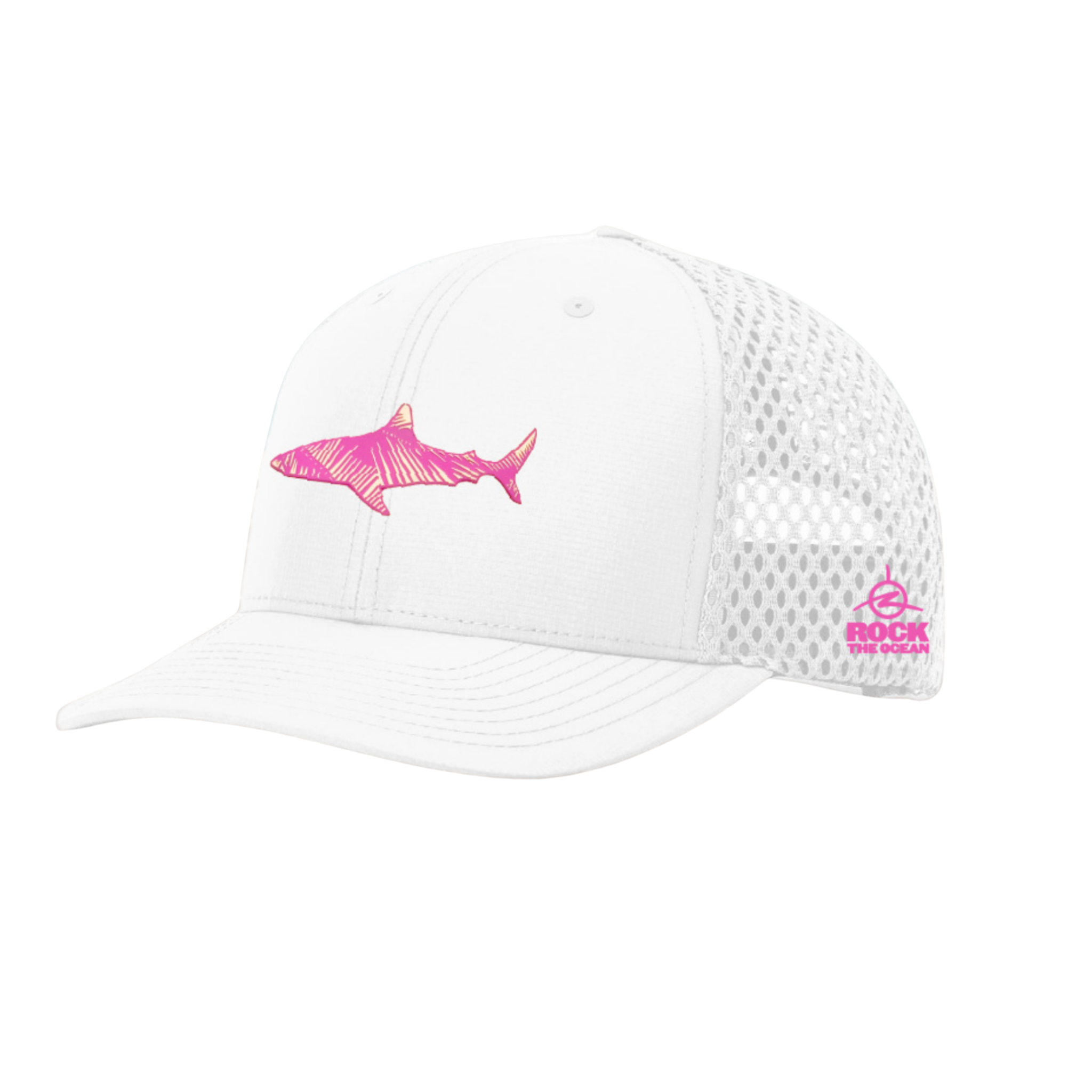 White cap with pink shark design on a sandy beach